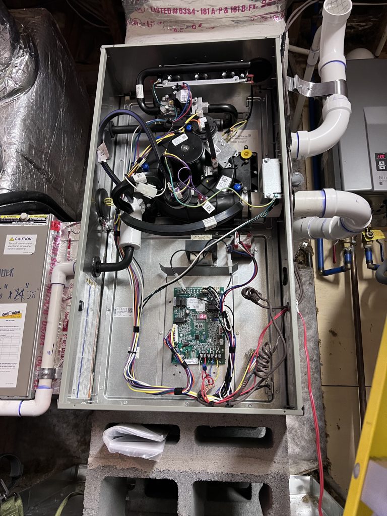 HVAC technician replacing a capacitor in Charlotte NC